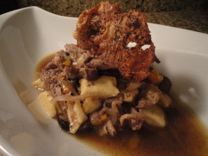 Ricotta gnocchi with pulled chicken, mushroom & pepper in an onion & herb broth, garnished with crispy chicken skins.